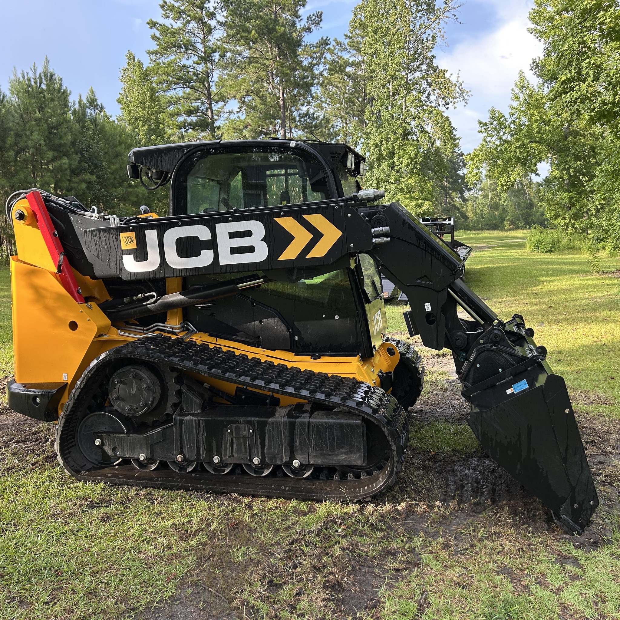 Heavy equipment performing underbrush clearing in the Savannah area