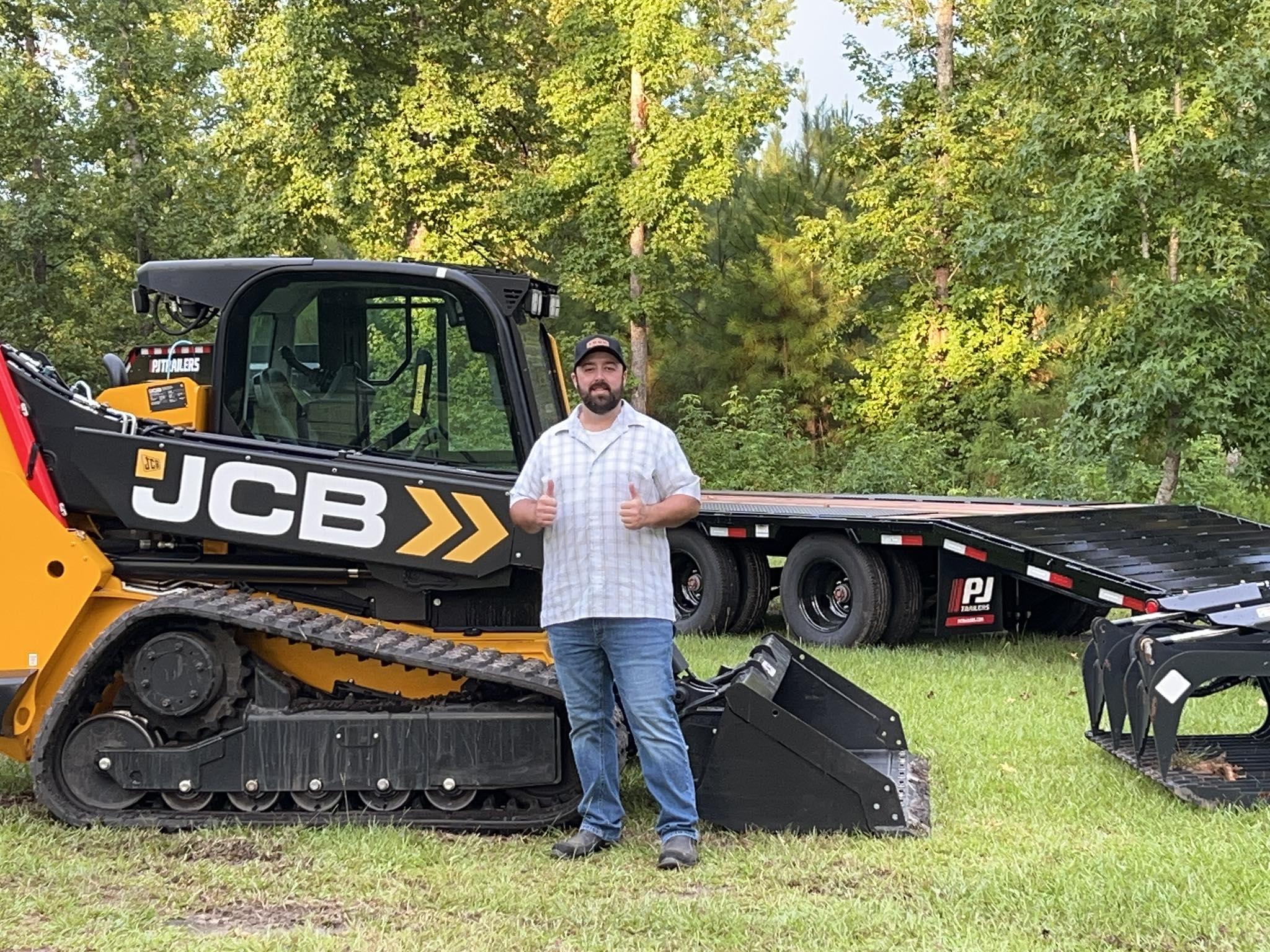 Wayne Bowen, owner of Land Clearing LLC, in front of his JCB Teleskid forestry mulcher in Savannah, GA