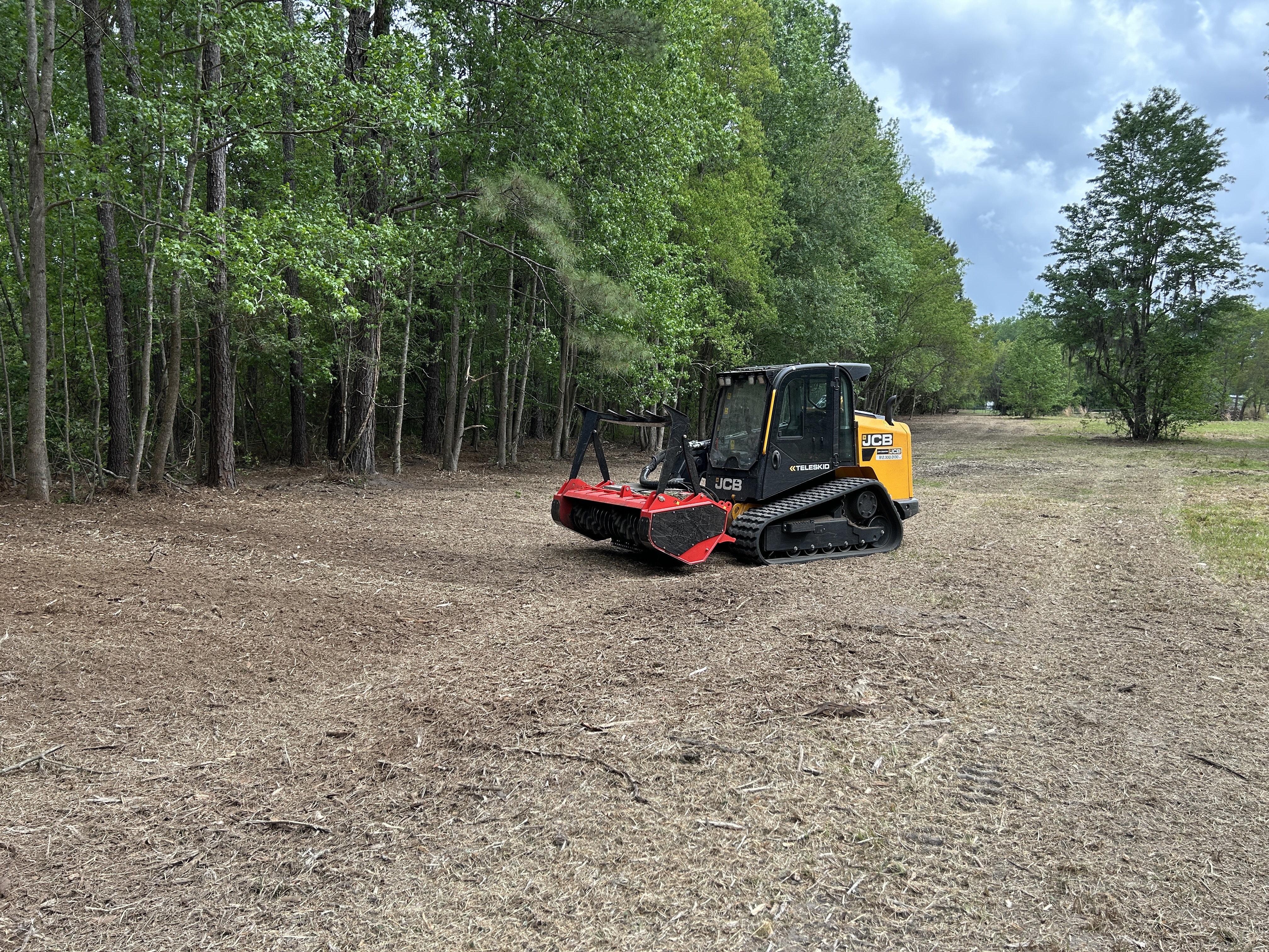 JCB Teleskid with forestry mulcher on a cleared property in the Savannah area